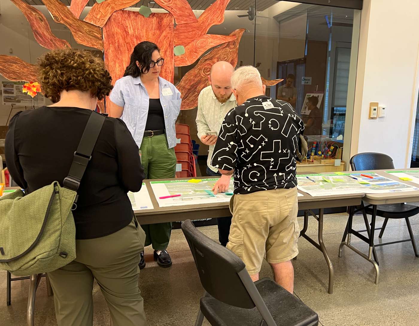 Neighbors reviewing design boards at the third Cayuga / Alemany Greening open house